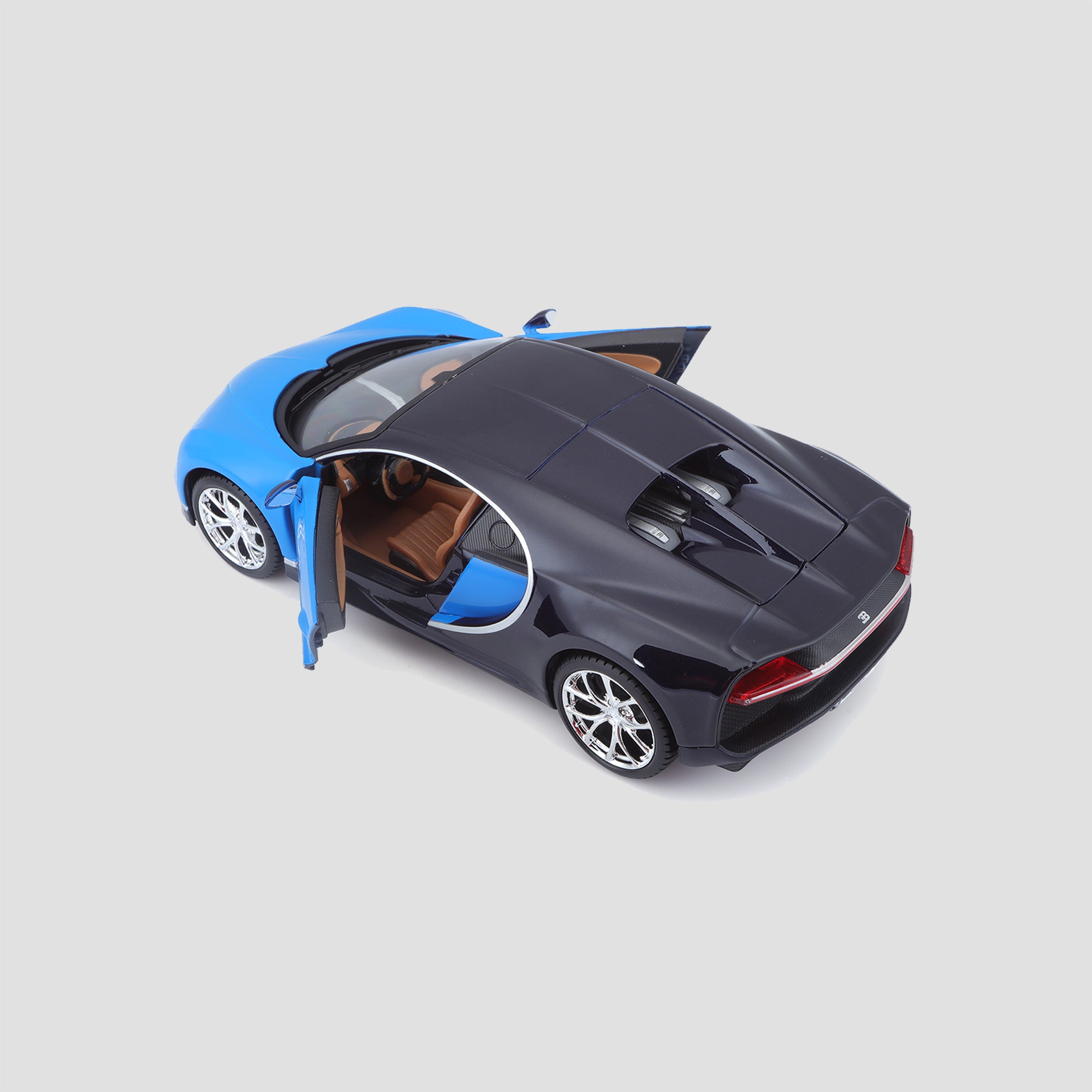 1:24 scale model of the Bugatti Chiron in blue with black with doors & bonnet open, view from behind.