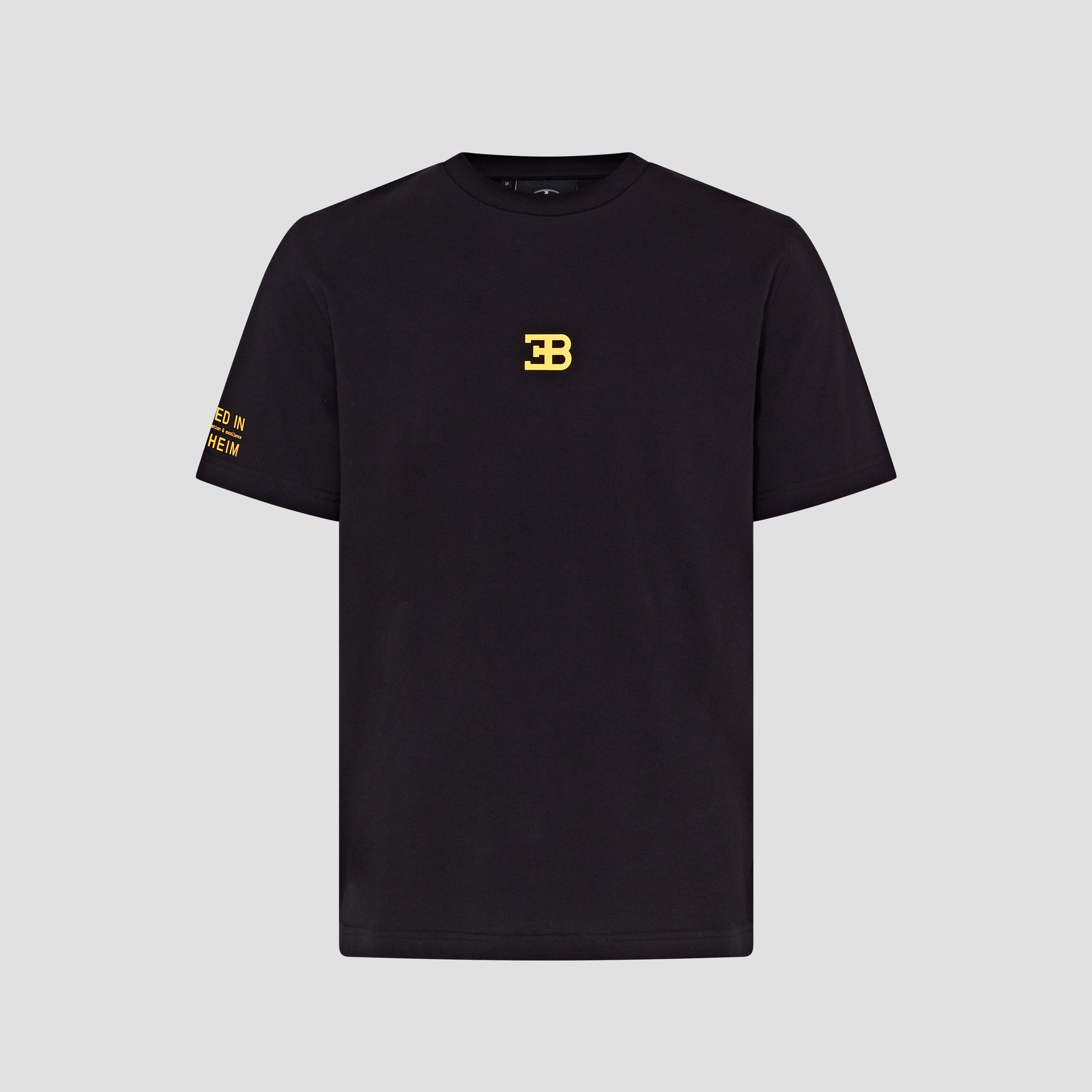 A black crew neck t-shirt with gold text and logo embroidery on the chest.