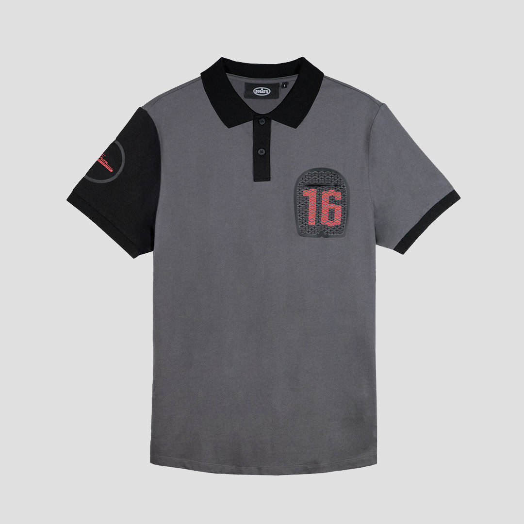 A short-sleeved grey polo shirt with a collar, featuring a large embroidered logo on the front and a subtle graphic on the back. The shirt is made from 100% cotton.