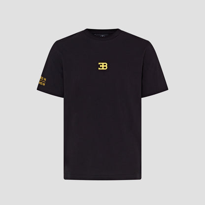 A black crew neck t-shirt with gold text and logo embroidery on the chest.